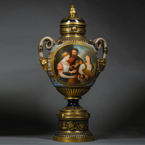 A Fine Vienna Style Porcelain Vase and Cover by Fischer & Mieg, Pirkenhammer, with a Painted Reserve of ‘An Allegory of Love’ After Titian, By Franz Wagner. Bohemia, Circa 1880.