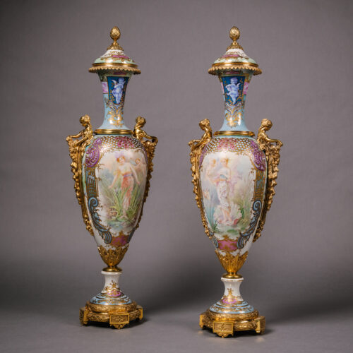 An Exceptional Pair of Gilt-Bronze Mounted Sèvres Style Iridescent-Ground Porcelain Vases and Covers.
